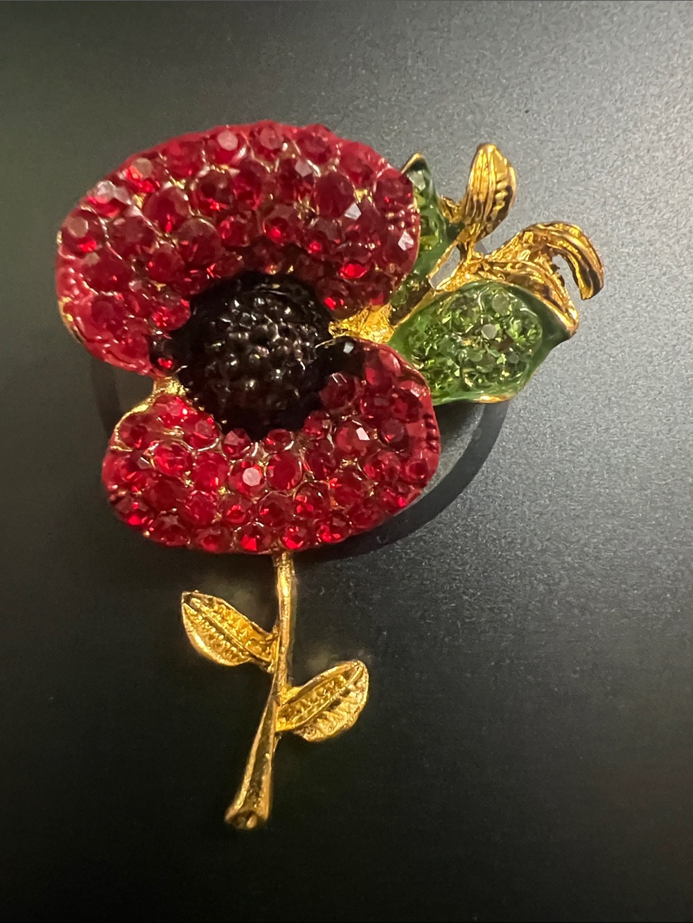 Red Crystal Poppy Flower Brooch with Green Leaf Accents